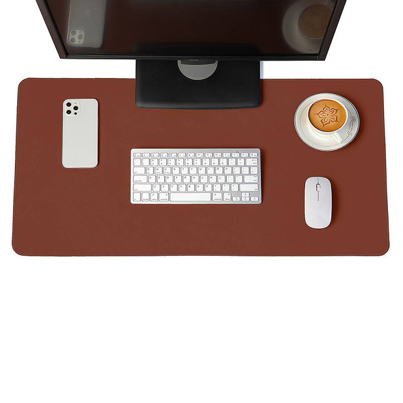 Minimalist brown vegan leather desk mat on a modern wooden desk setup