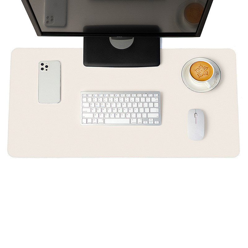 Minimalist white vegan leather desk mat on a modern wooden desk setup