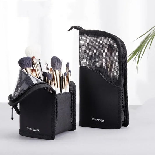 Black makeup brush organiser with brushes on a white background